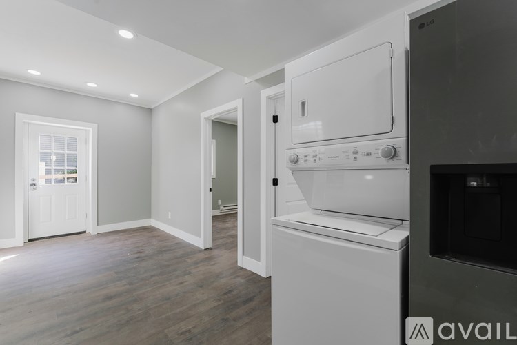 A kitchen with a white oven and microwave.
