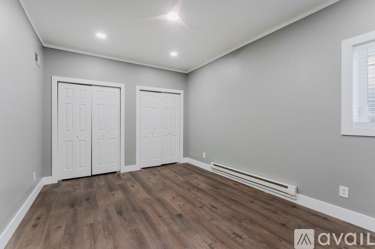 A room with two doors and a window.