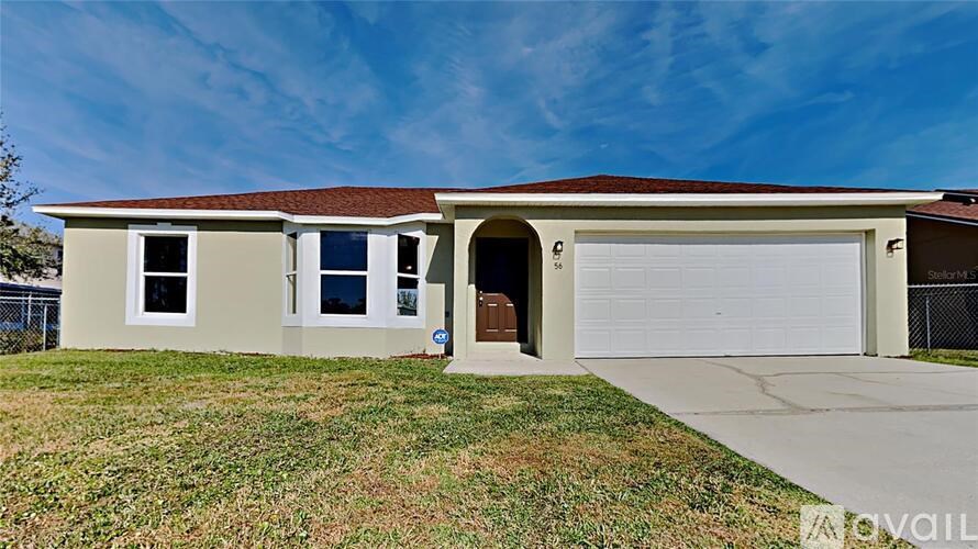 A two-story house with a garage and a brown roof.
