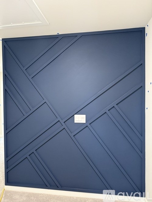 A blue door with a white handle.