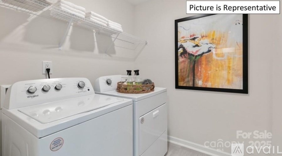 A white washing machine and dryer in a laundry room.
