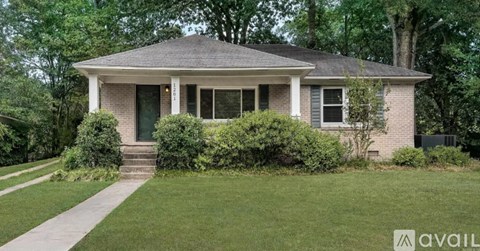 A house with a front yard and a sign that says "available".