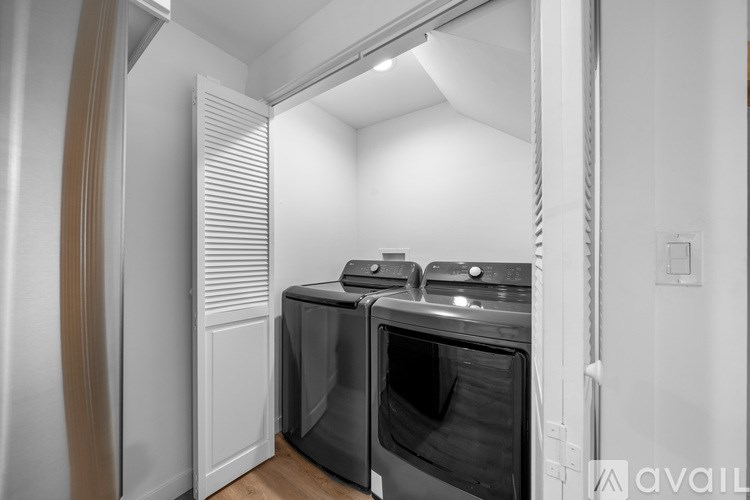 A modern kitchen with a stainless steel oven and a white interior.