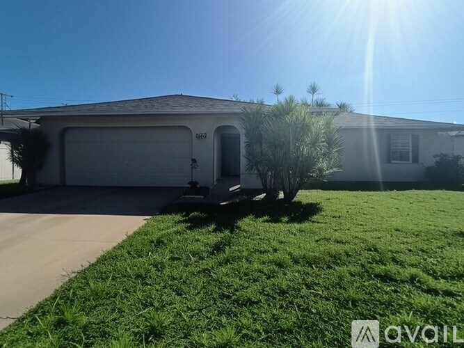 A house with a white garage door and a driveway.