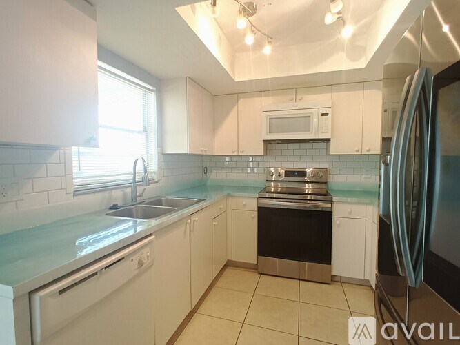 A room with a tiled floor and a ceiling fan.