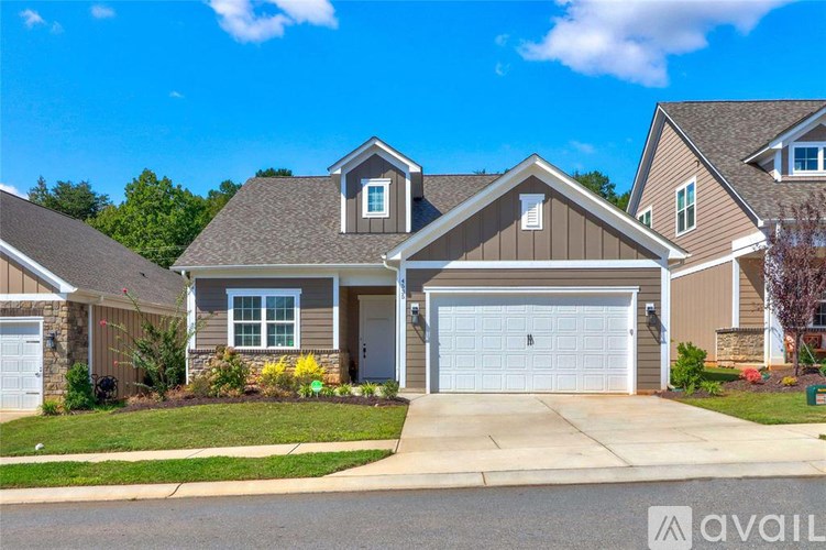 A house with a garage is available for sale.