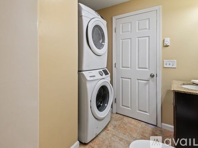 A washer and dryer in a laundry room.
