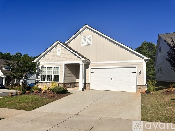 A two-car garage is attached to a house.