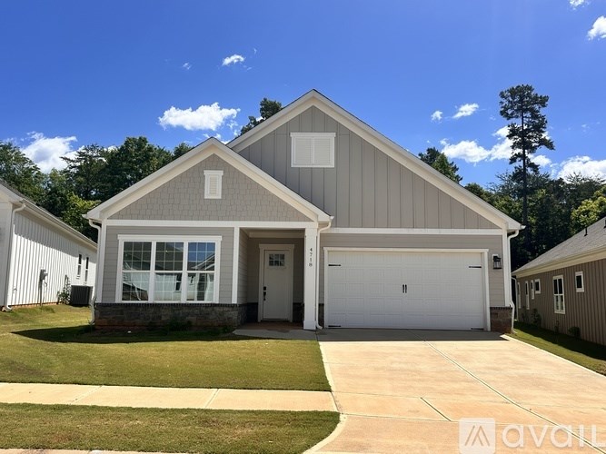 A two-car garage is attached to a house.