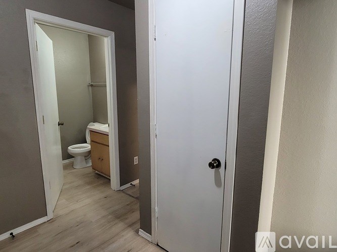 A bathroom with a toilet and sink in it.