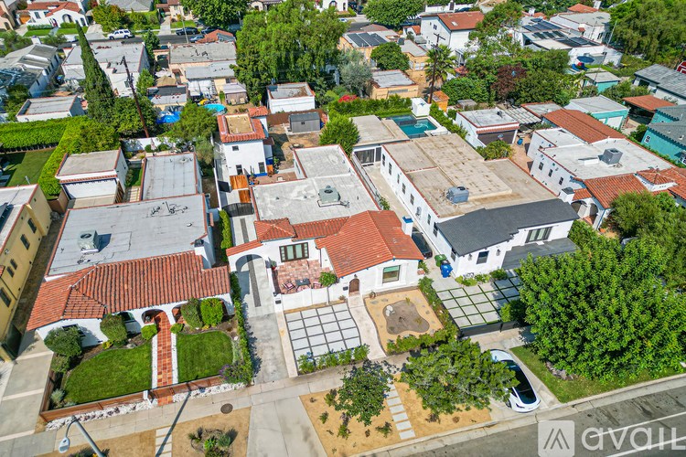 A bird's eye view of a residential area with houses and trees.
