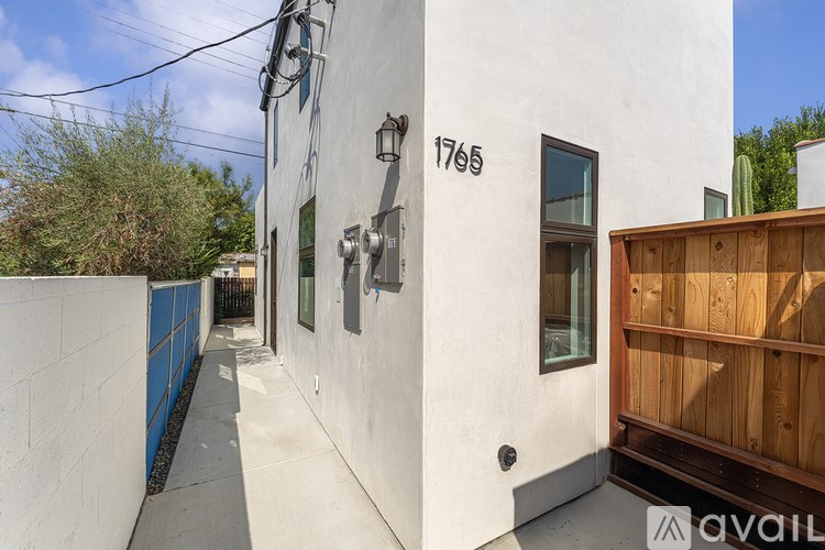 A white house with the number 1765 on it.