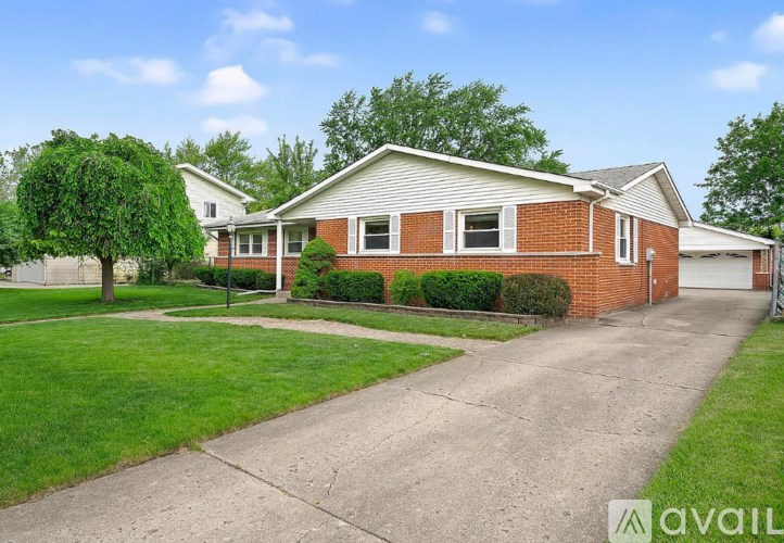A house with a driveway in front of it.