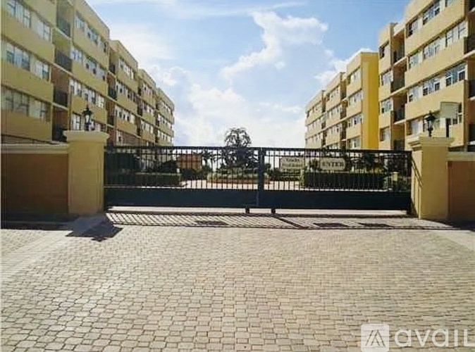 A sunny day at the entrance of a residential building.