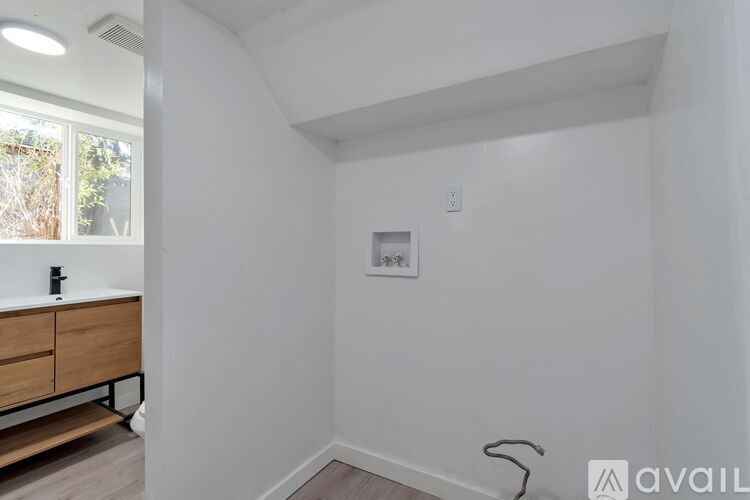 A modern kitchen with a granite countertop and stainless steel appliances.