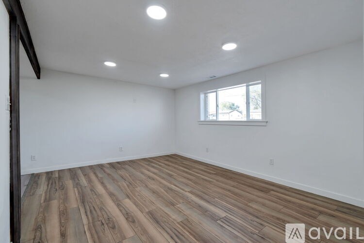 A bathroom with a white sink, toilet, and bathtub.