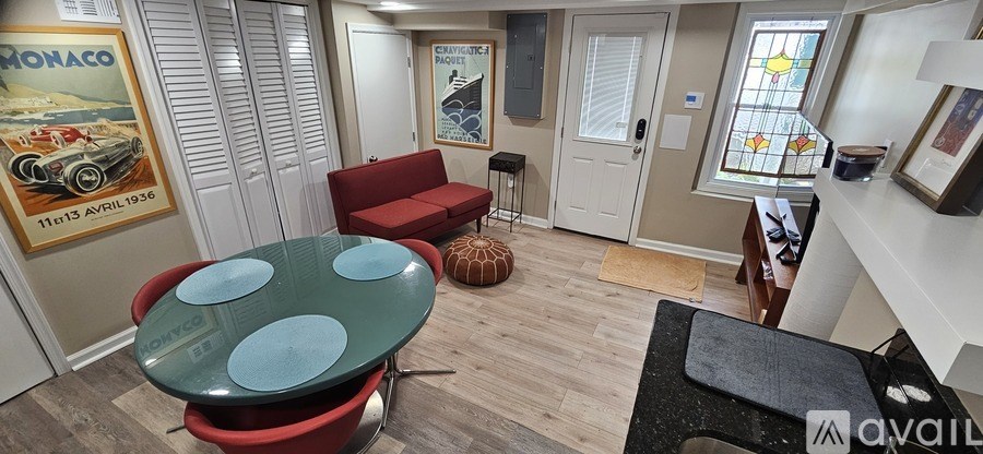 A washing machine is built into a wall in a laundry room.
