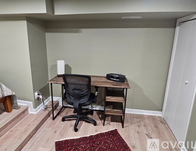 A bathroom with a toilet and a walk-in shower.