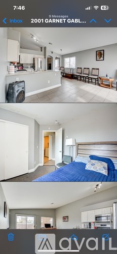 A living room with a couch and a television.