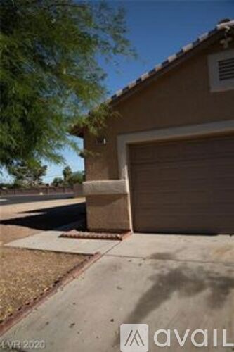 A house with a closed brown garage door.