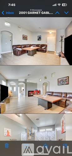 A living room with a brown couch and a television.
