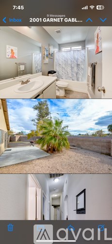 A bathroom with a toilet, sink, and shower.