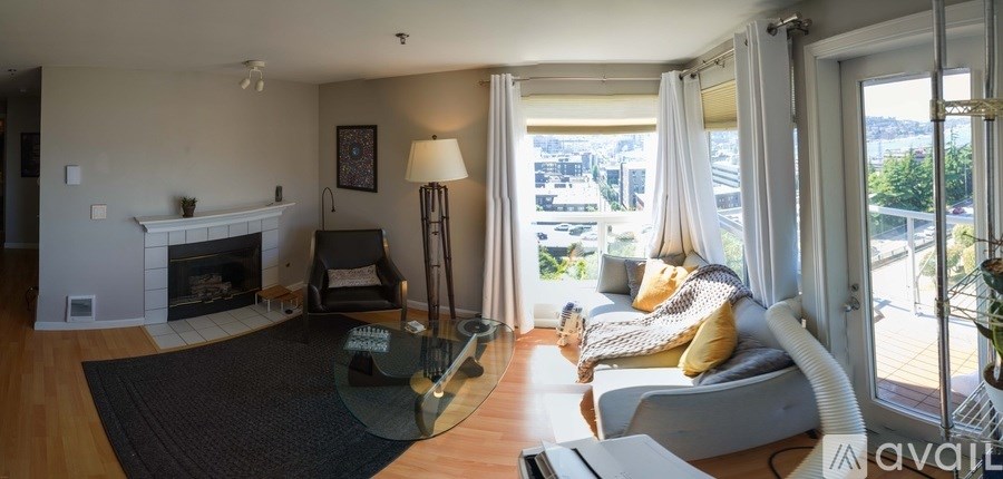 A living room with a fireplace and a couch.