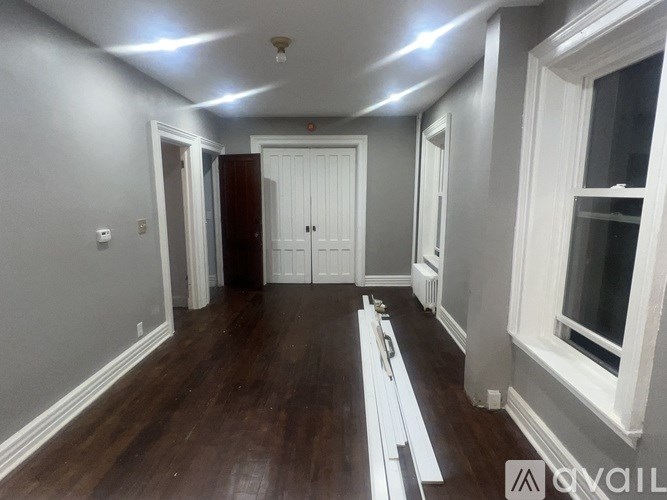 A room with wooden floors and white trim.