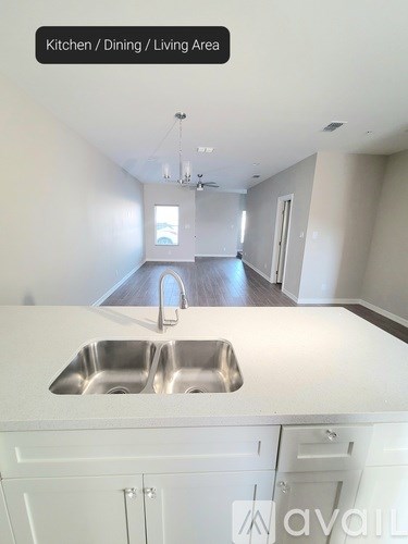 A kitchen with a sink and cabinets.