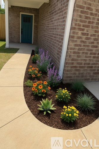 A garden in front of a house with a blue door.