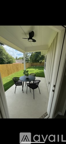A patio with a table and chairs is shown.