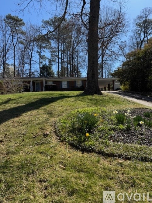 A house with a tree in front of it.