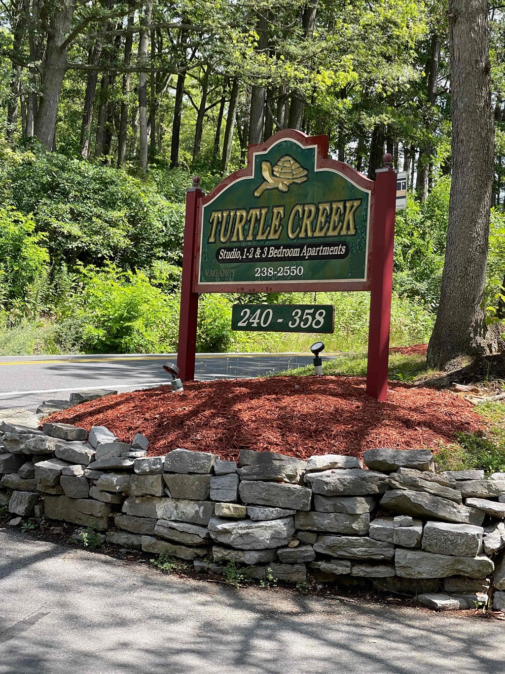 A sign for Turley Creek Studios, 14 & Bedroom Apartments with a phone number 238-2550.