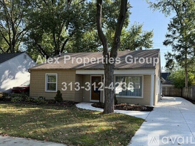 A house with a sign that says Alex Properties Group and a phone number.