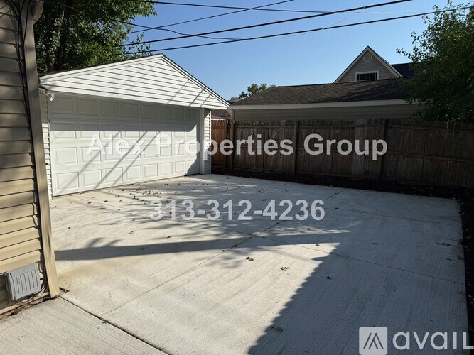 A garage door with Alex Properties Group written on it.