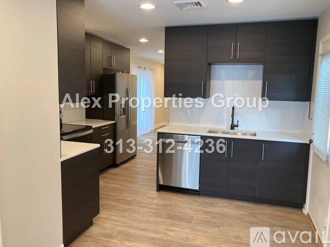 A modern kitchen with a phone number and company name overlaid.