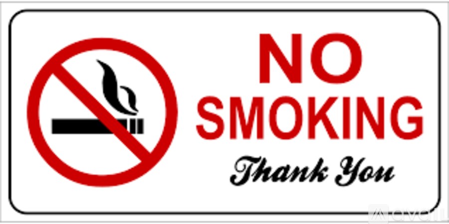 A sign with a no smoking symbol and the words "NO SMOKING Thank You".