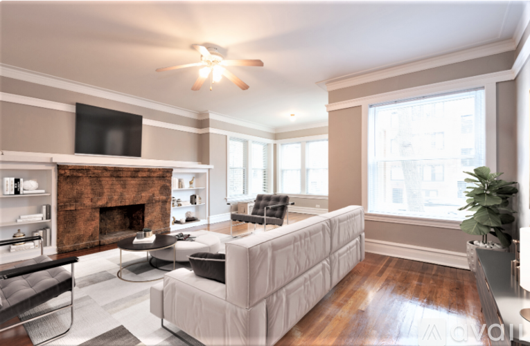 A living room with a fireplace and a couch.