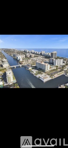 A cityscape with a river running through it.