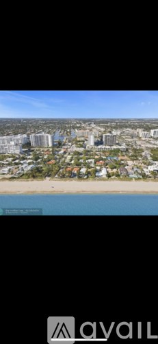 A cityscape with buildings and a beach.