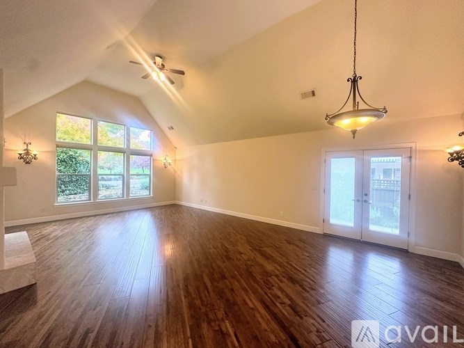 A room with a white door and a window.