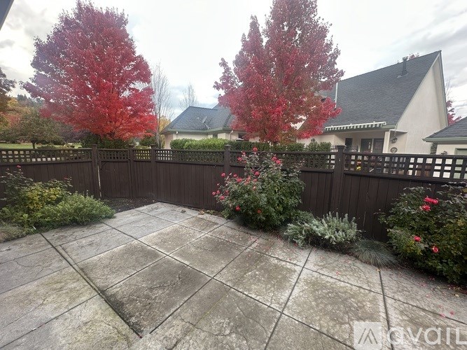 A bathroom with a tub and a mirror.