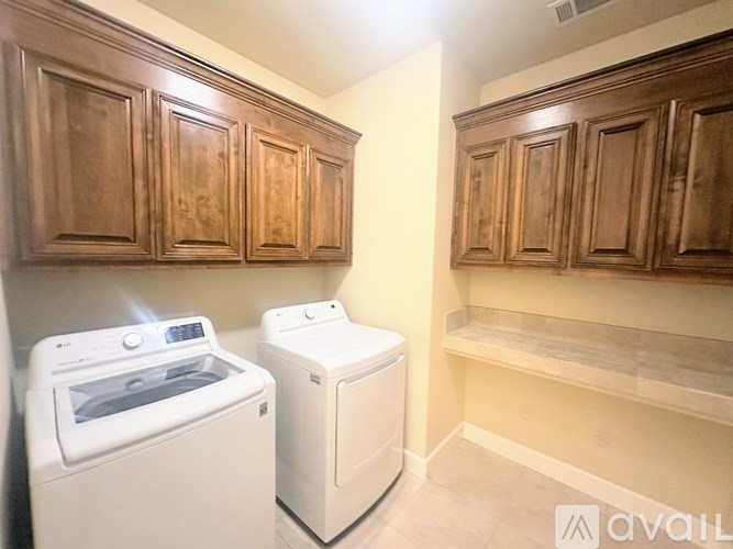 A laundry room with a washer and dryer.