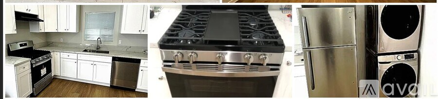 A kitchen with white cabinets and a stainless steel refrigerator.