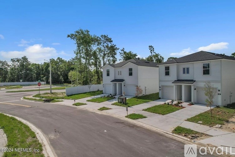 A row of houses with a sign that says "available" in front of them.