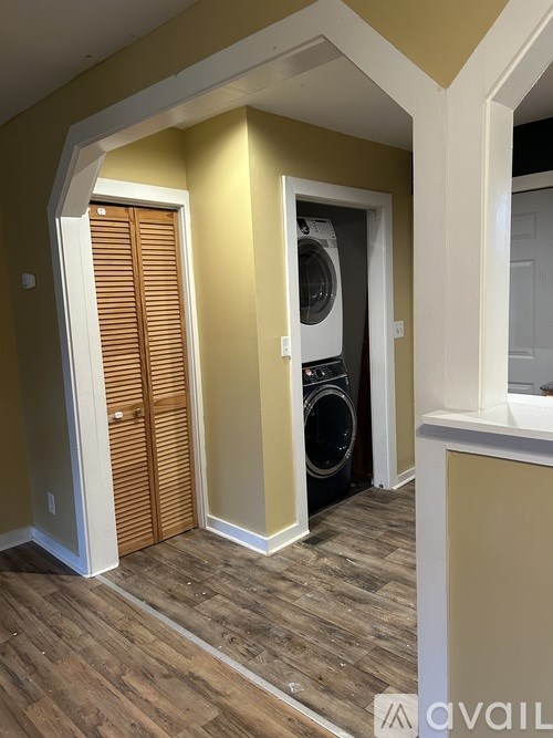 A laundry room with a washer and dryer.