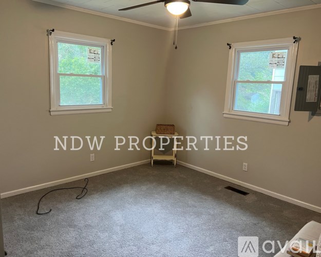 A room with NDW PROPERTIES written on the wall.