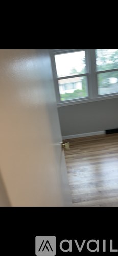 A room with a window and a door.