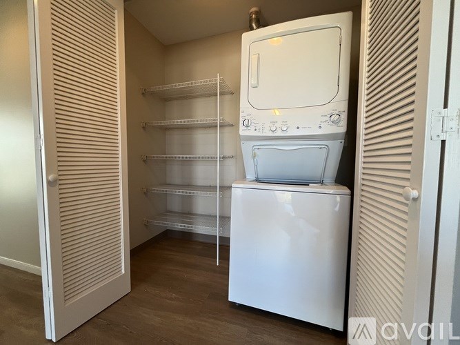 A pool table with balls and a cue stick on it.