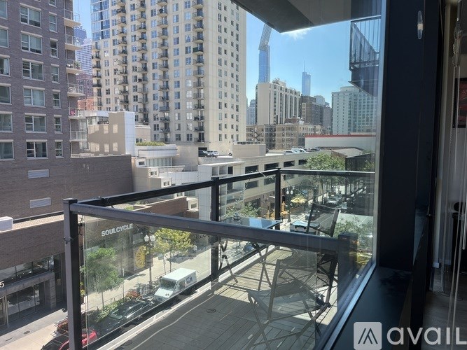 A balcony with a view of a city skyline.